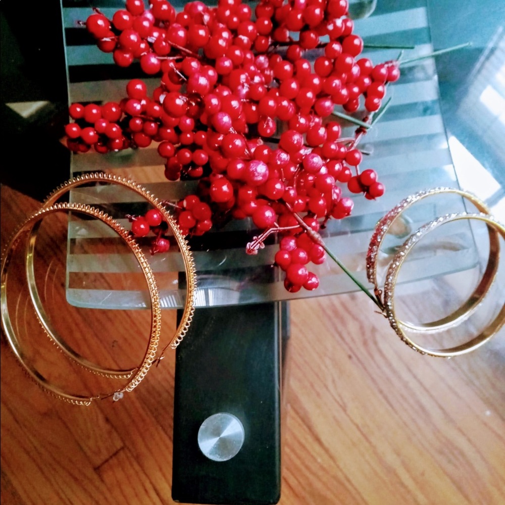 Woman’s gold hoops
